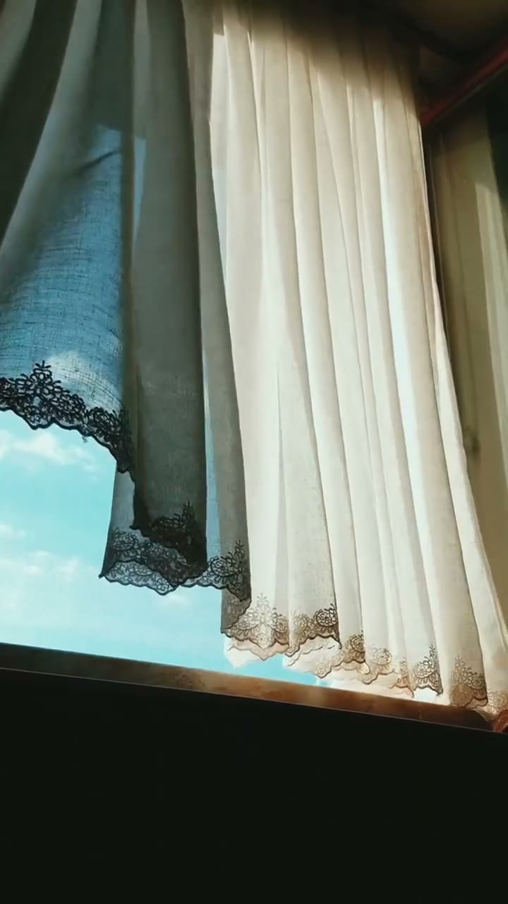 Soft morning light through sheer curtains